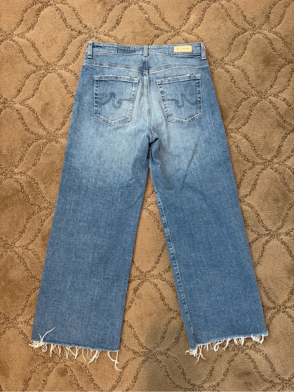 High-Rise Light Blue Wide-Leg Jeans with Frayed Hem